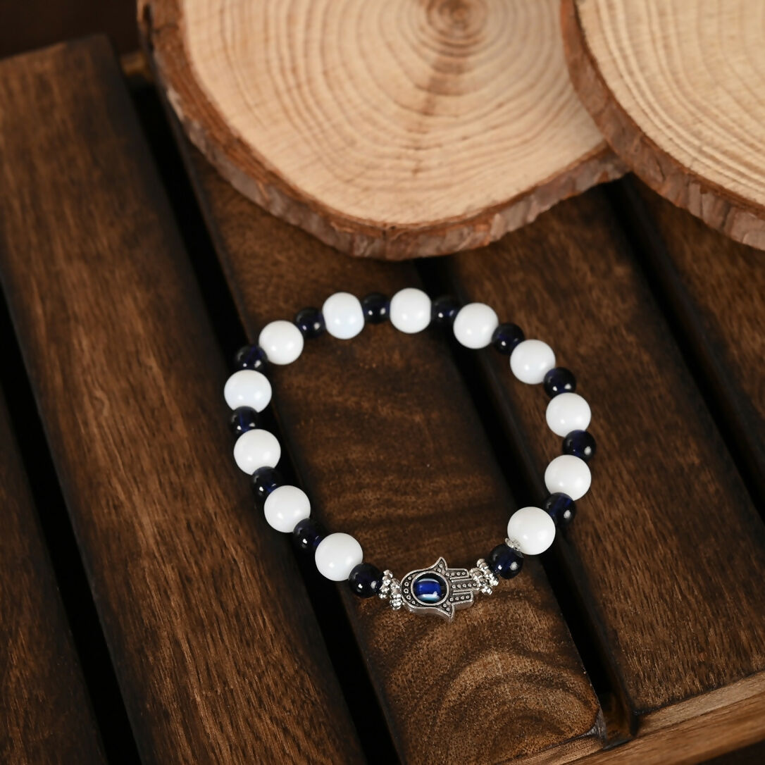 NVR Women & Men Black & White Evil Eye Elasticated Rakhi With Roli Chawal | Grocsy