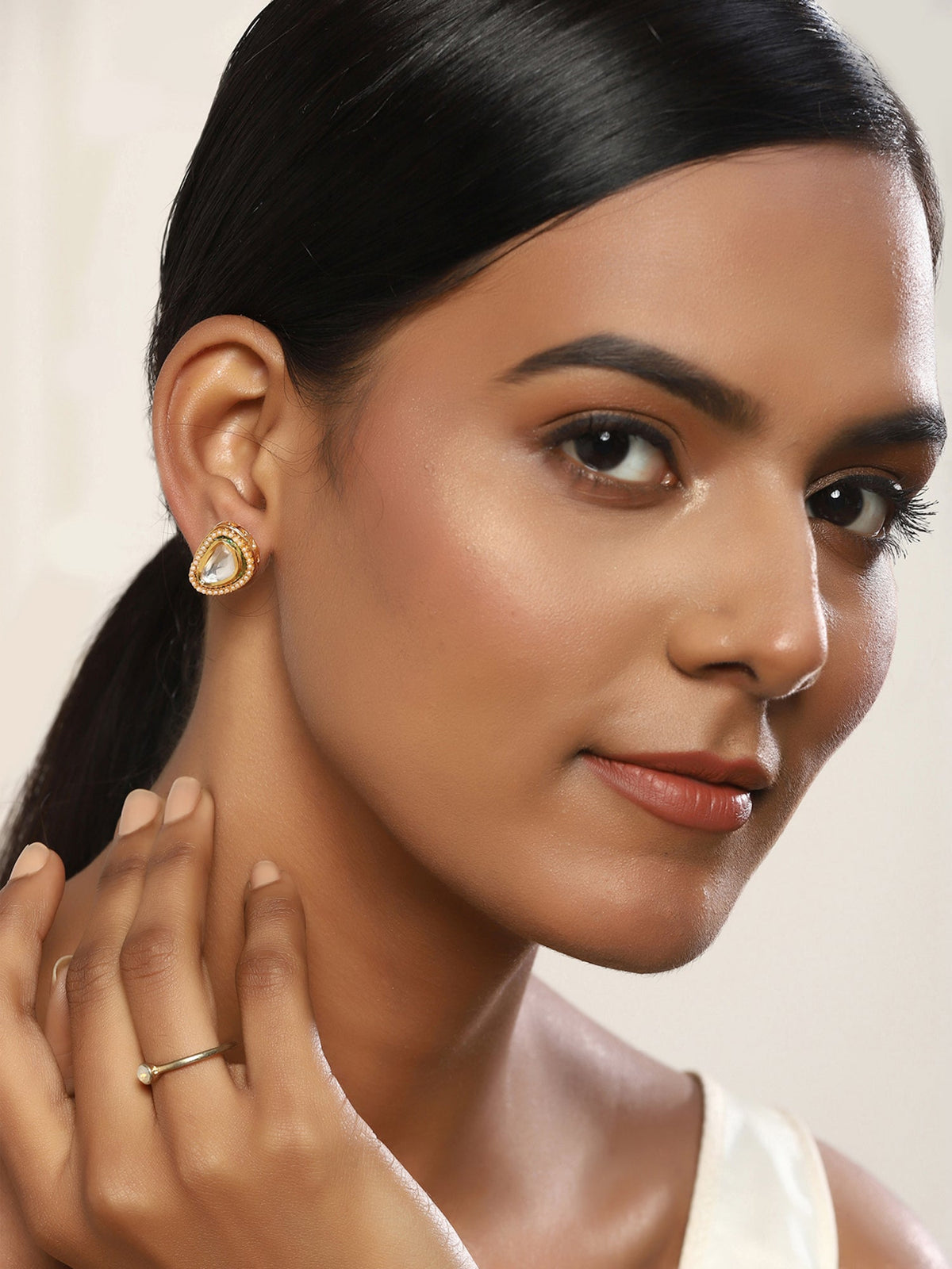 Gold-Polished Triangular Studs Earrings - Ruby Raang | Grocsy