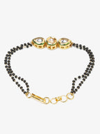 Black Gold-Toned Kundan Bracelet Mangalsutra - Ruby Raang