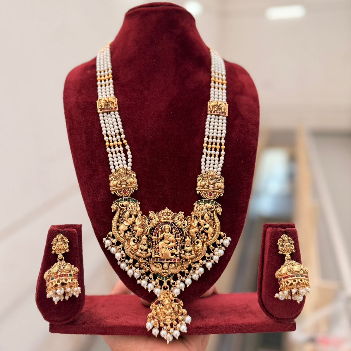 Jewel City Antique Gold-Plated Temple Lakshmi Haram Necklace Set with White Beads & Jhumka Earrings | Grocsy