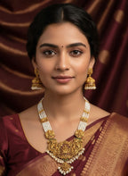Jewel City Antique Gold-Plated Temple Lakshmi Haram Necklace Set with White Beads & Jhumka Earrings | Grocsy