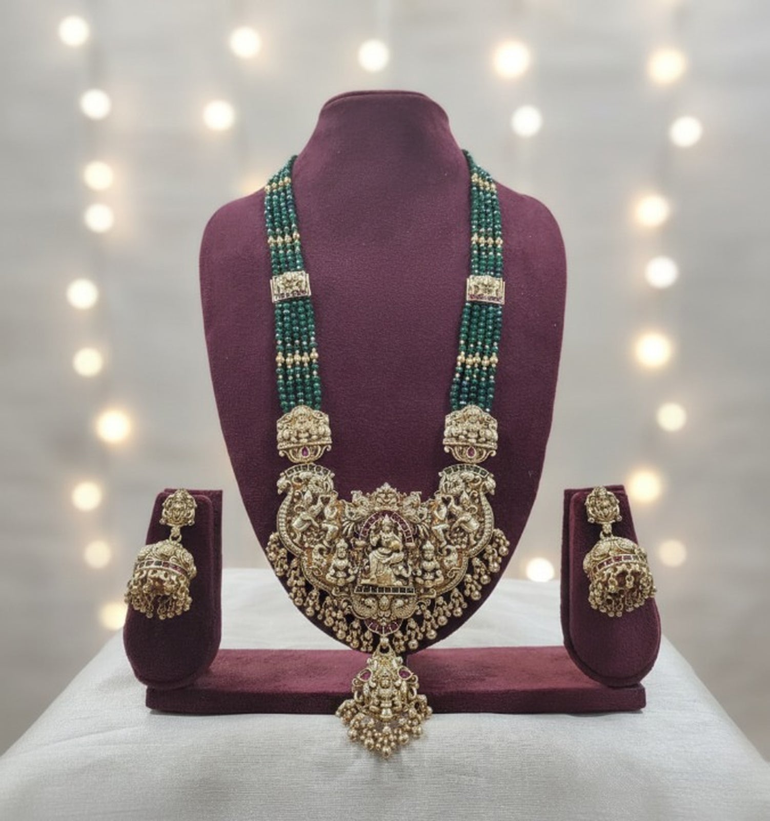 Jewel City Royal Temple Lakshmi Gold-Plated Bridal Haram Necklace Set with Jhumka Earrings, Green Beads, Traditional Jewelry | Grocsy