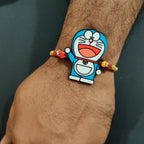 Indianvibez Doraemon Wooden Rakhi with Rudraksha, Cartoon Rakhi for Bro, Shop India - Kids Rakhi | Grocsy