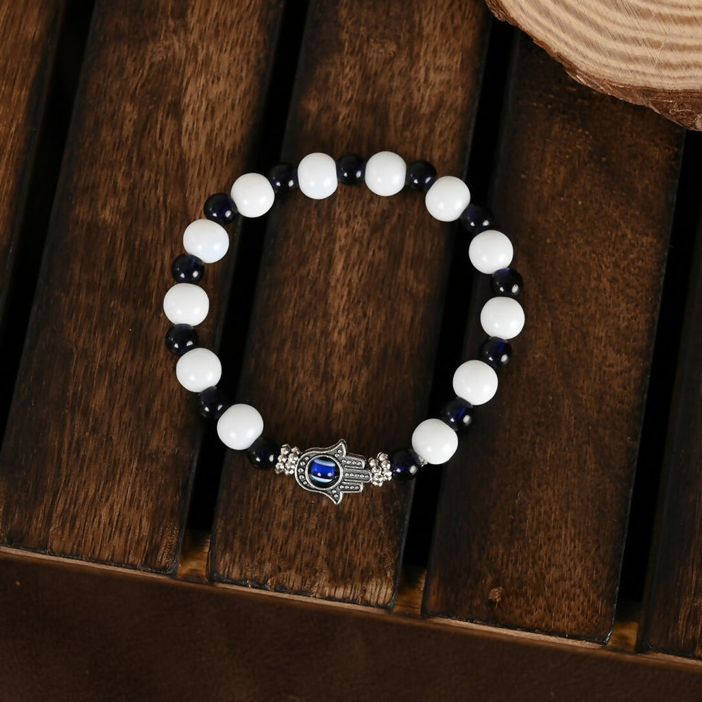 NVR Women & Men Black & White Evil Eye Elasticated Rakhi With Roli Chawal | Grocsy
