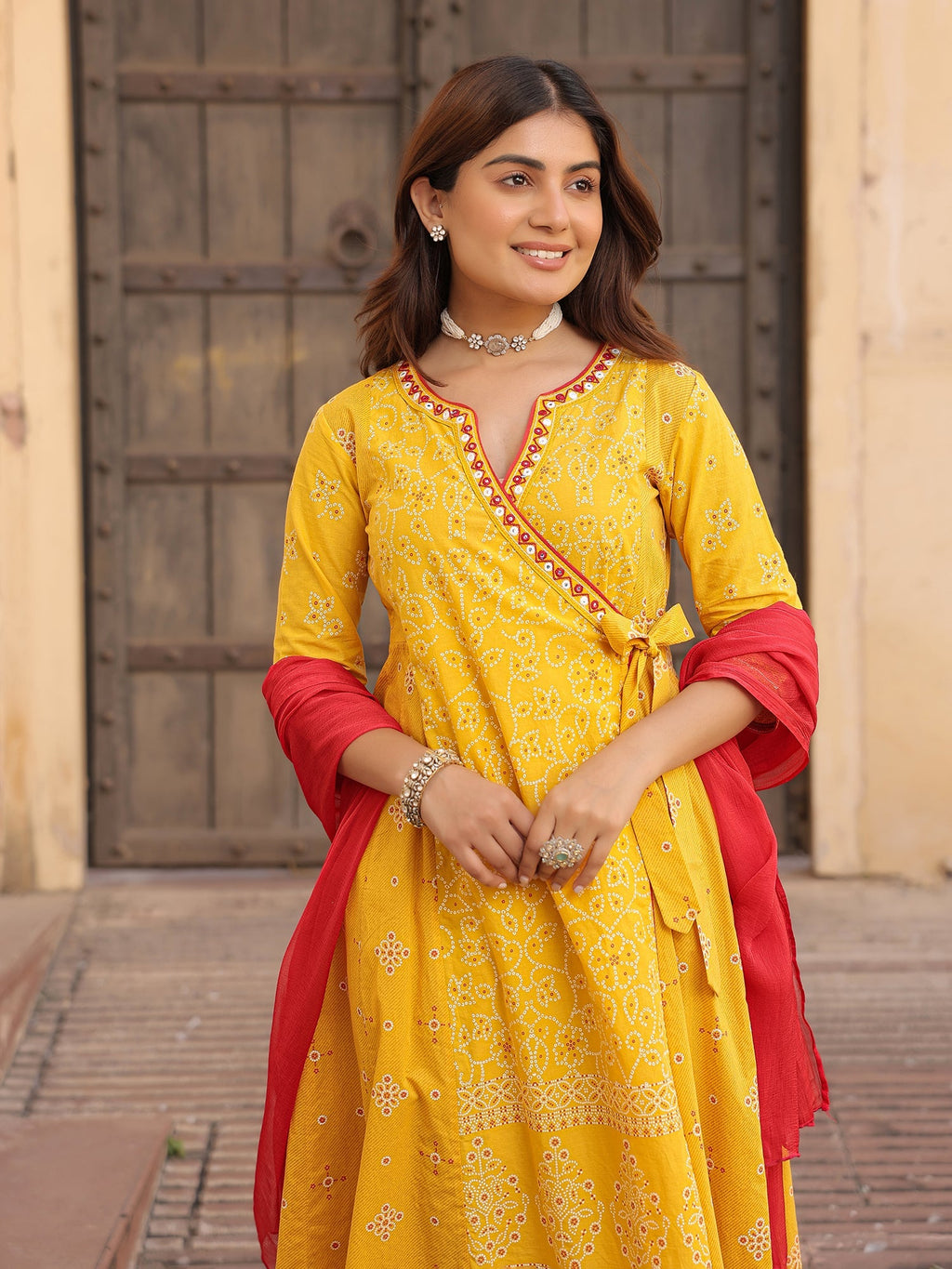 Juniper Mustard Bandhani Print Angrakha Cotton Kurta With Pants & Dupatta Set With Mirror Work Embroidery | Grocsy
