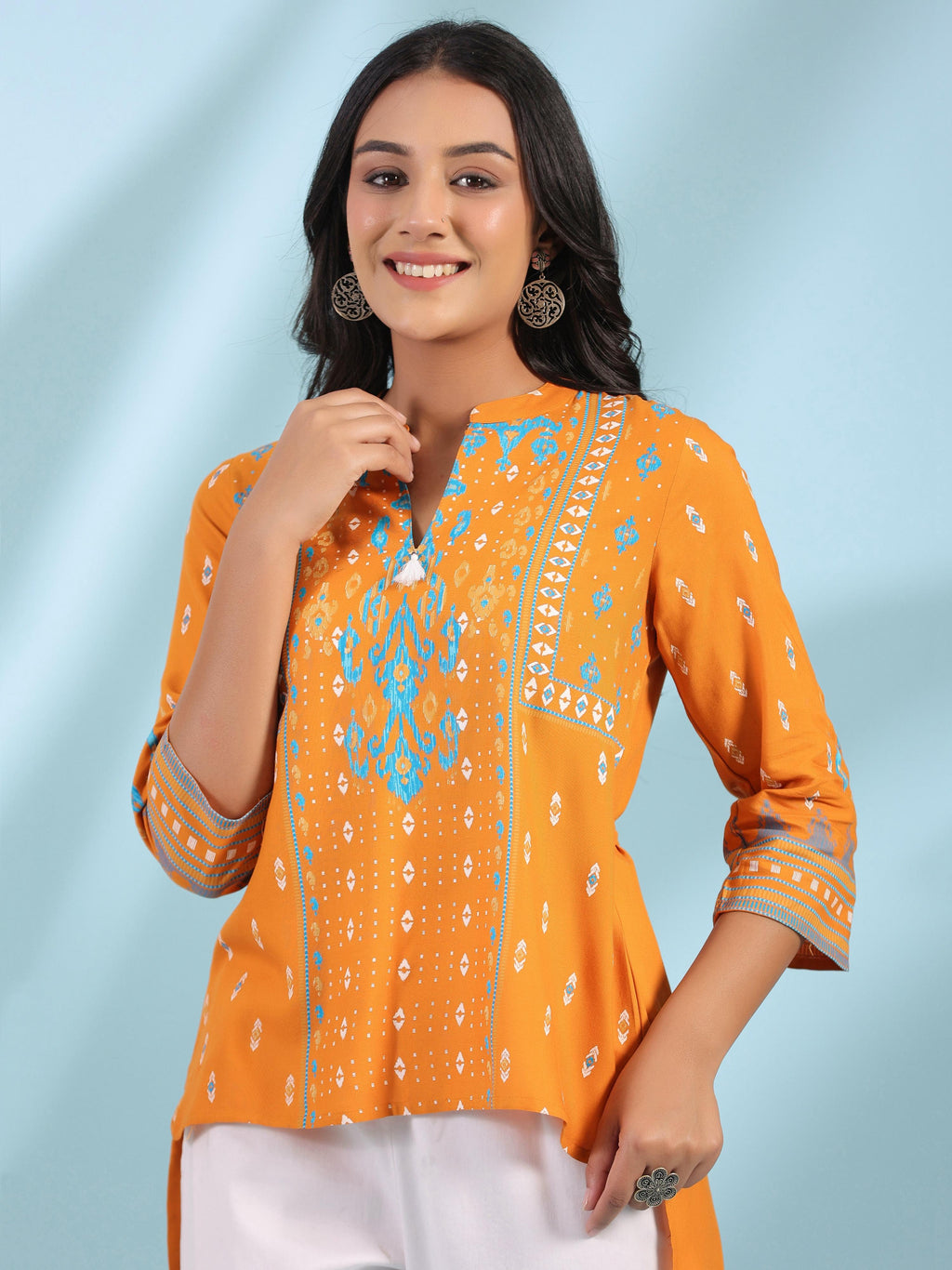 Juniper Mustard Rayon Ikat Placement Printed High-Low Tunic With Side Slits & Tassels | Grocsy