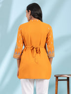Juniper Mustard Rayon Ikat Placement Printed High-Low Tunic With Side Slits & Tassels | Grocsy