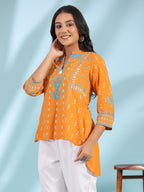 Juniper Mustard Rayon Ikat Placement Printed High-Low Tunic With Side Slits & Tassels | Grocsy