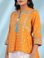 Juniper Mustard Rayon Ikat Placement Printed High-Low Tunic With Side Slits & Tassels | Grocsy