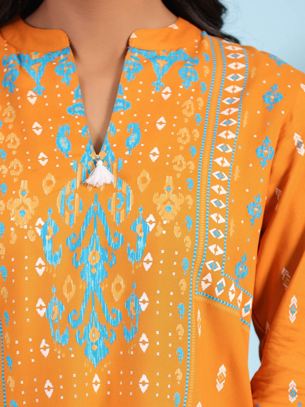 Juniper Mustard Rayon Ikat Placement Printed High-Low Tunic With Side Slits & Tassels | Grocsy
