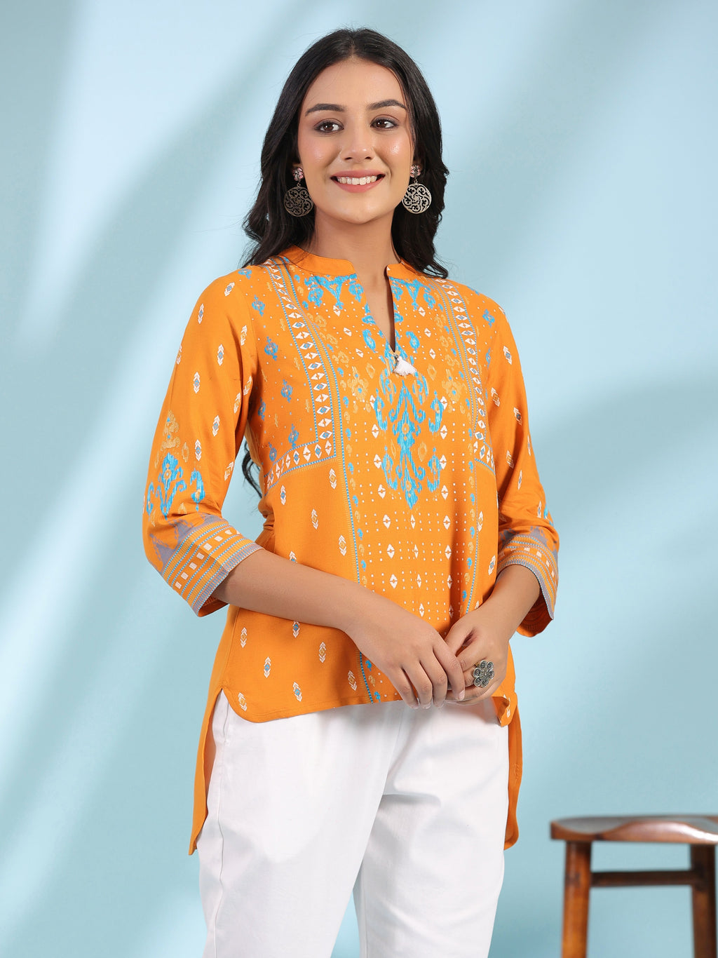 Juniper Mustard Rayon Ikat Placement Printed High-Low Tunic With Side Slits & Tassels | Grocsy