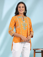 Juniper Mustard Rayon Ikat Placement Printed High-Low Tunic With Side Slits & Tassels | Grocsy
