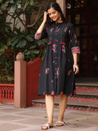 Juniper Black Floral Printed A-Line Pleated Cotton Dress With Kantha Work & Tassels | Grocsy
