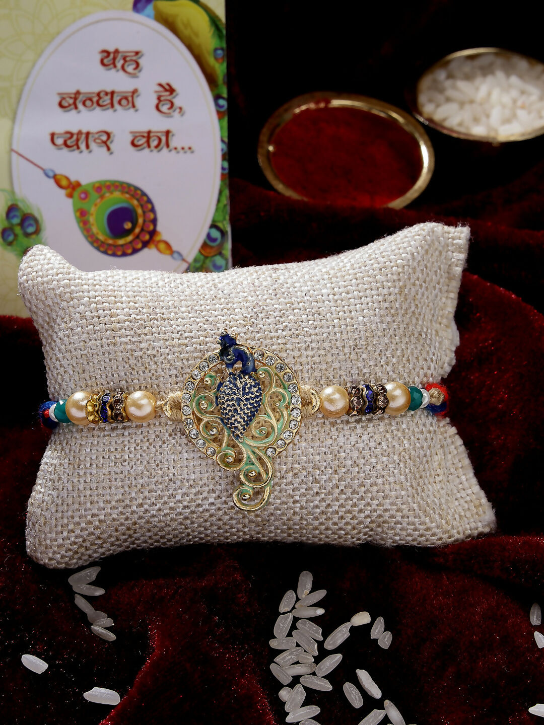 NVR Men Gold-Toned Peacock Design Stone-Studdded Rakhi With Roli Chawal & Chocolate | Grocsy