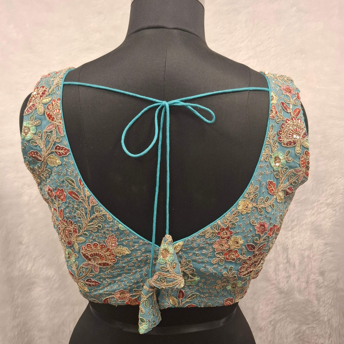 Kia Fashions Aqua Blue Georgette Multi Color Emb & Sqn Readymade Blouse | Grocsy