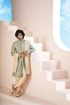 Majestic Mint Green Dupion Silk Sherwani With Satin Dhoti & Santone Dupatta by Hilo Design | Grocsy