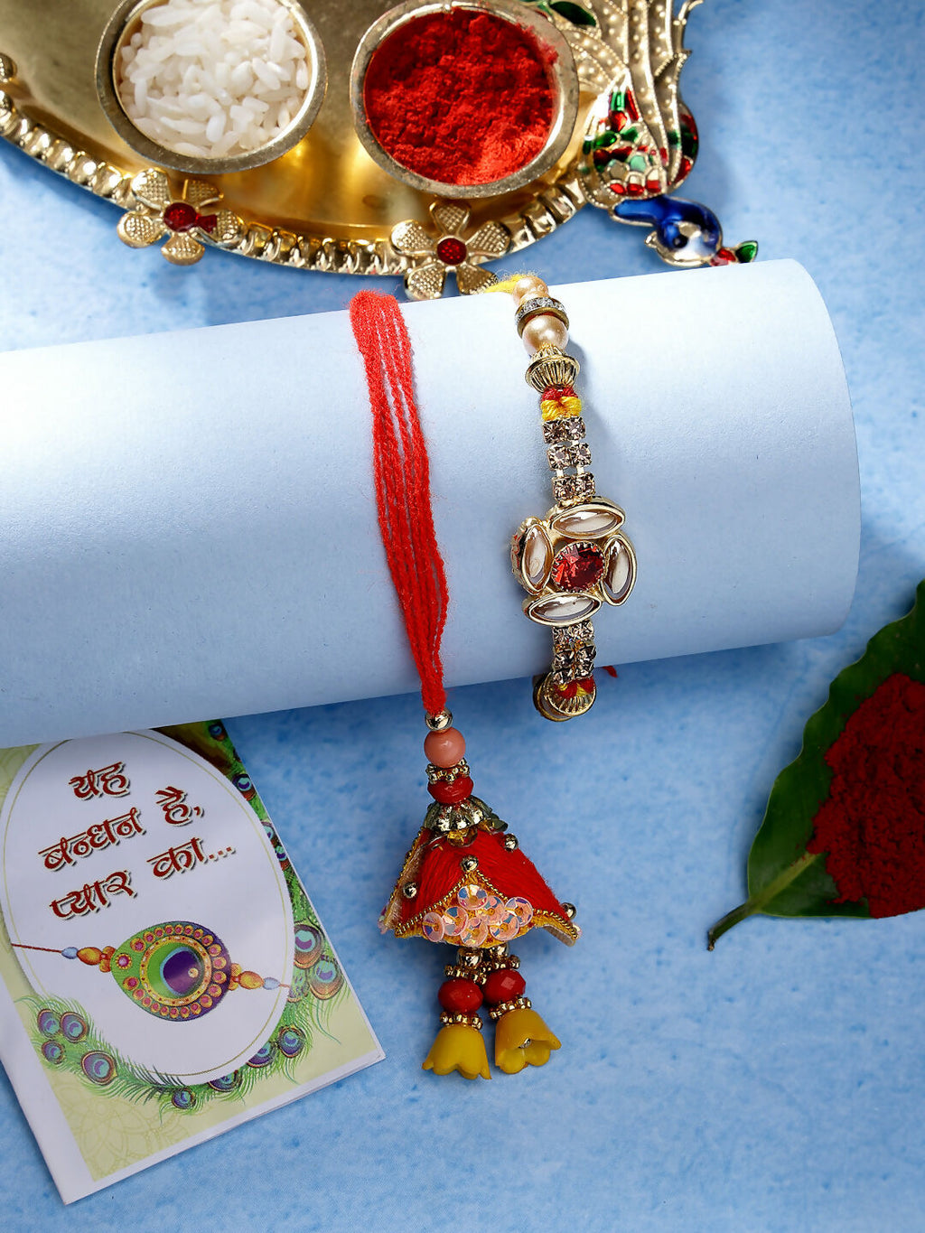 NVR Women & Men Set of 2 Red & Gold-Toned Stone-Studded Bhaiya Bhabhi Rakhi With Roli Chawal & Chocolate | Grocsy