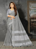 Shree Shyam Fashion Elegant Light Grey Woven Linen Saree with Contrast Zari Border & Tassels - Soft & Breathable Party Wear | Grocsy