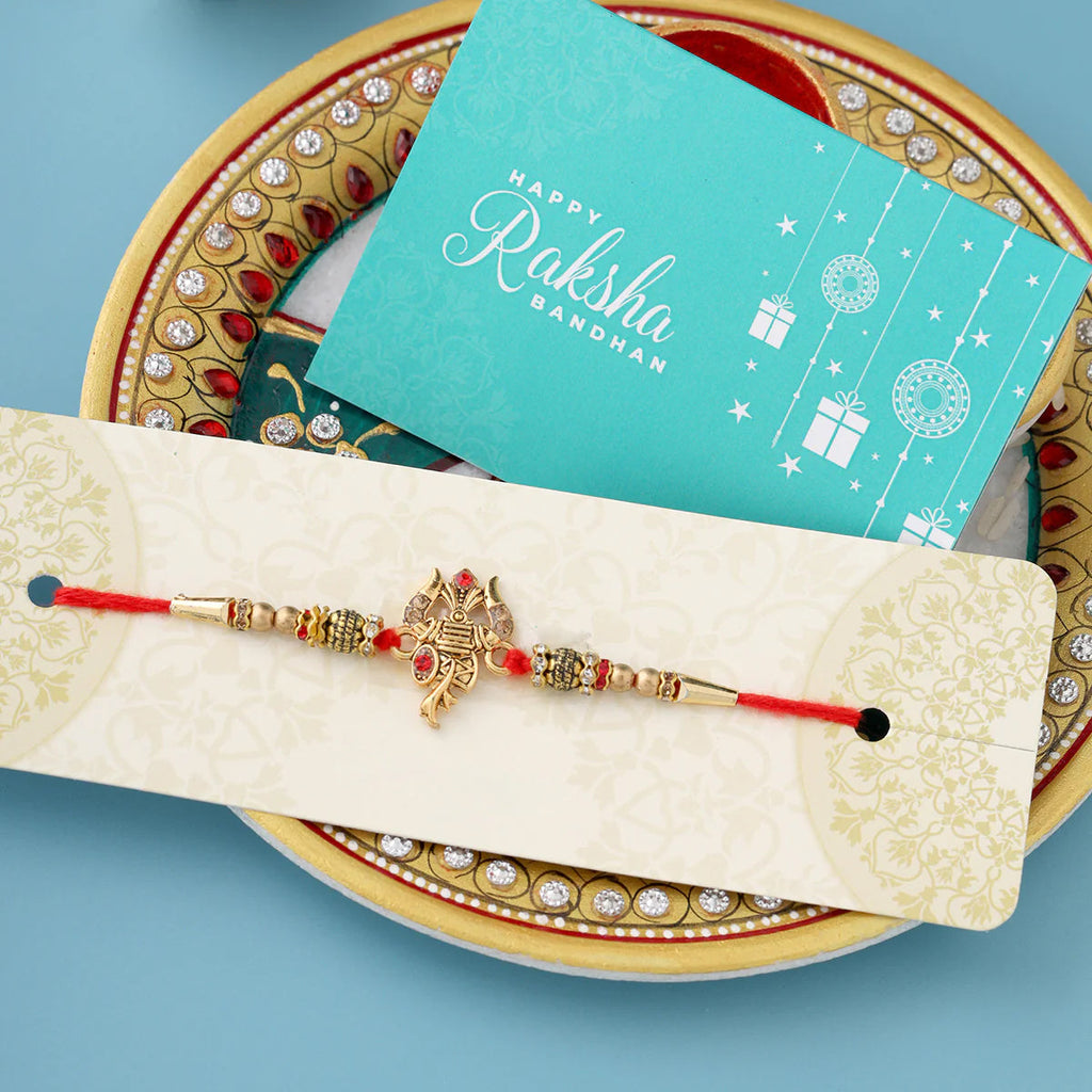 trueBrowns X Voylla Designer Ganesha Rakhi With Roli Chaawal Pack | Grocsy