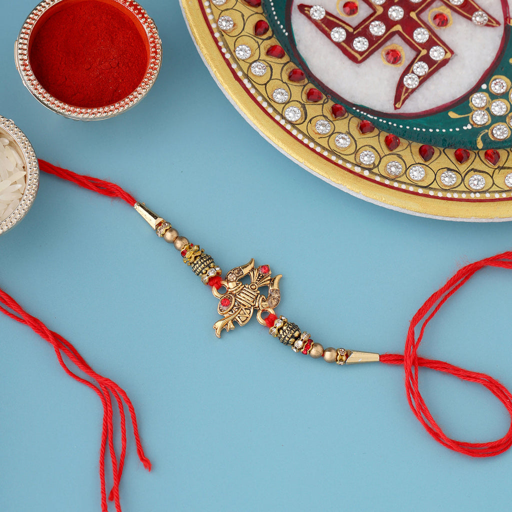 trueBrowns X Voylla Designer Ganesha Rakhi With Roli Chaawal Pack | Grocsy