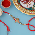 trueBrowns X Voylla Designer Ganesha Rakhi With Roli Chaawal Pack | Grocsy