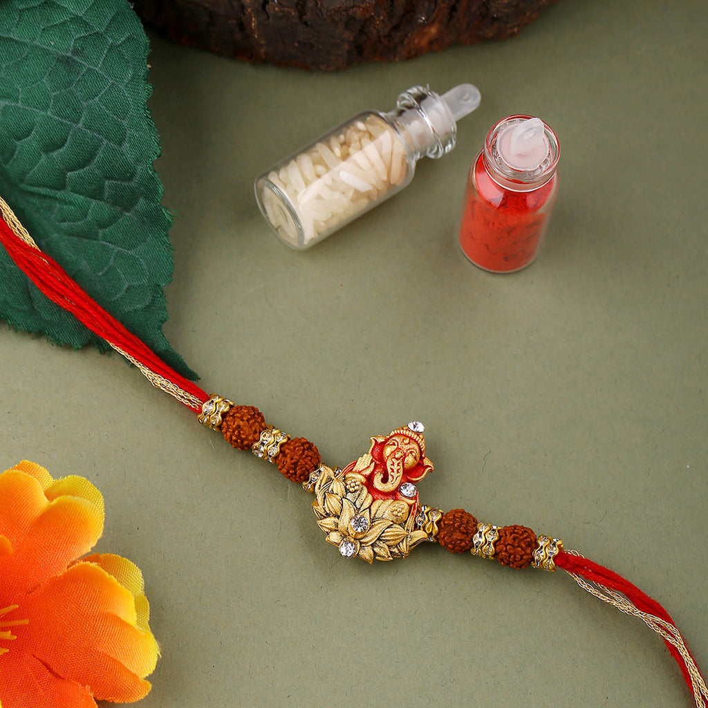 trueBrowns X Voylla Divine Rudraksha Ganesha Rakhi With Roli Chaawal Pack | Grocsy