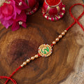 trueBrowns X Voylla Beige Beaded Enamel Rakhi With Roli Chaawal Pack | Grocsy