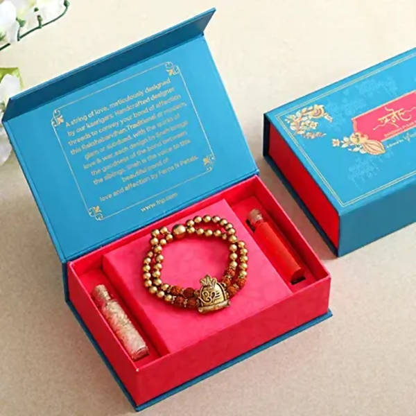 Om Pearl Bracelet Rakhi & Fruit N Nut Chocolates | Grocsy