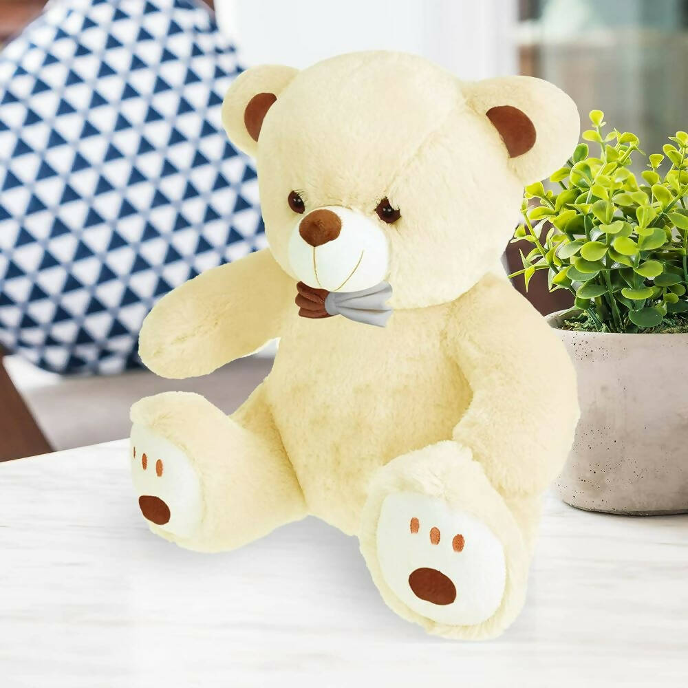 Webby Plush Cute Sitting Teddy Bear Soft Toys with Neck Bow and Foot Print (Beige) | Grocsy