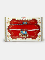 NVR Women & Men Set of 2 Blue Lotus Shape Kundan-Studded & Beaded Wraparound Rakhi Set With Roli Chawal & Chocolate | Grocsy