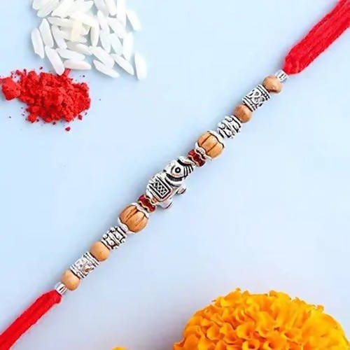 Feng Shui Rakhi With Besan Laddoo & Cashew Jar | Grocsy