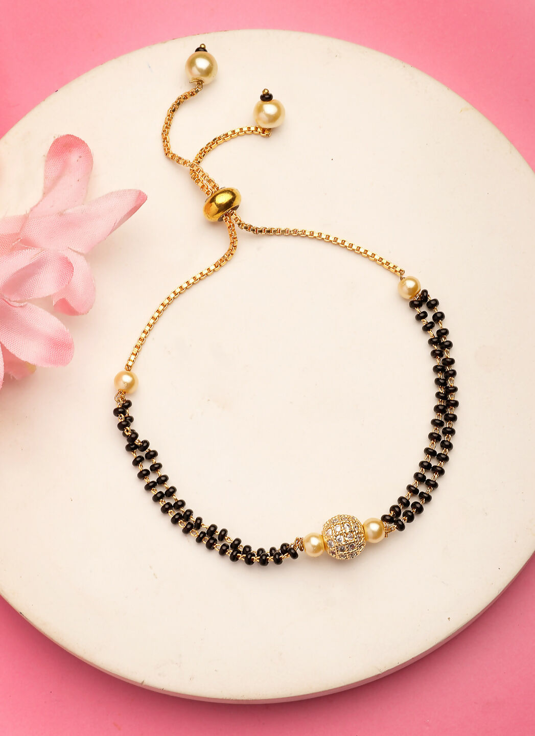 NVR Women Gold-Polished & Black Brass AD-Studded Hand Mangalsutra Bracelet | Grocsy