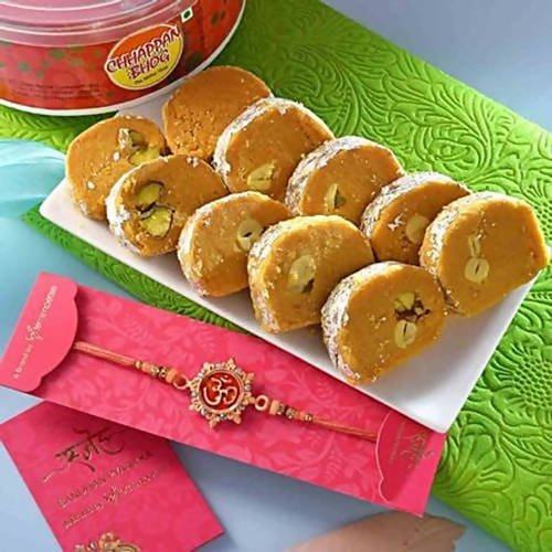 Auspicious Peach Om Rakhi & Batisha Slice Combo | Grocsy