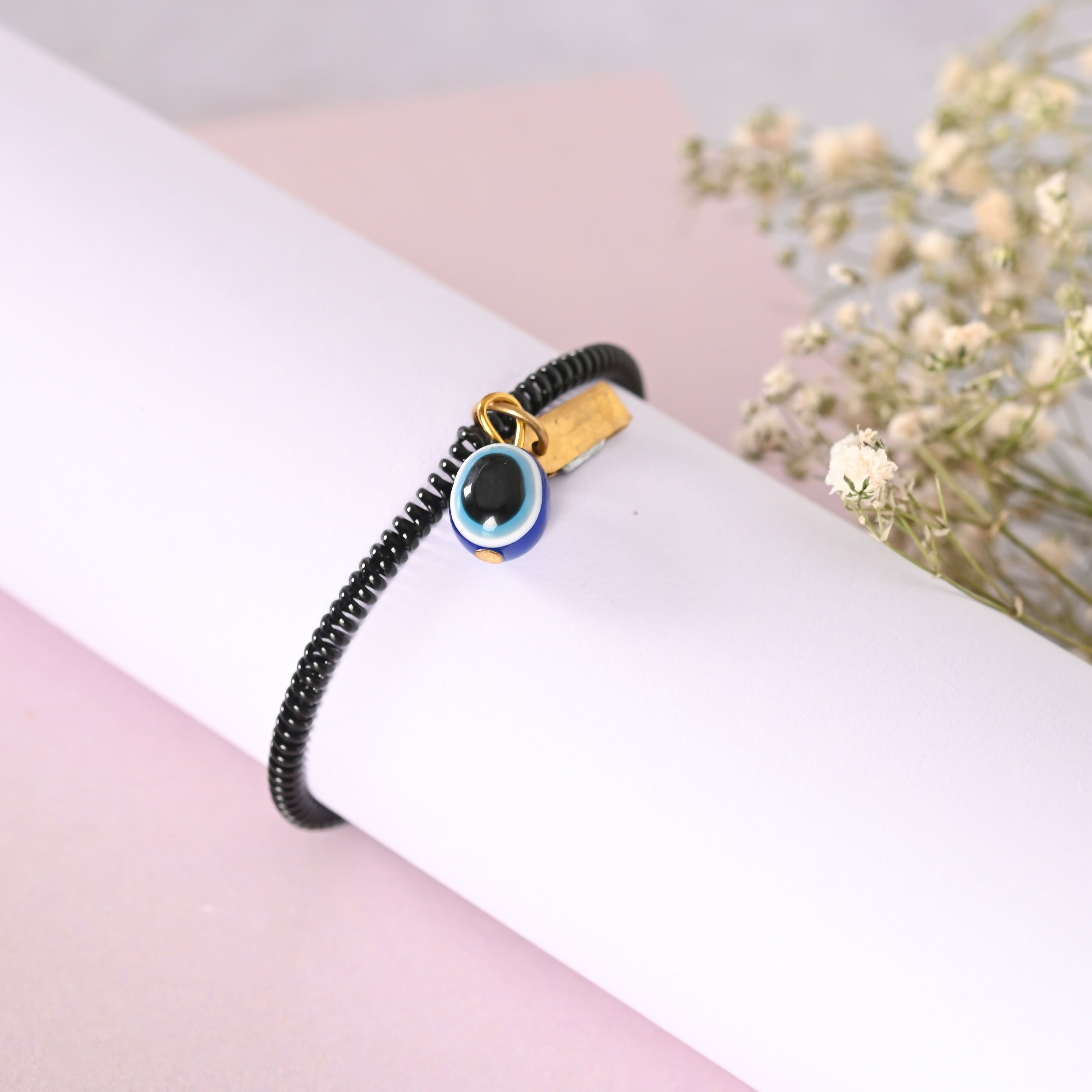 NVR Men & Women Black Evil Eye Crystal Spring Ring Bracelet | Grocsy