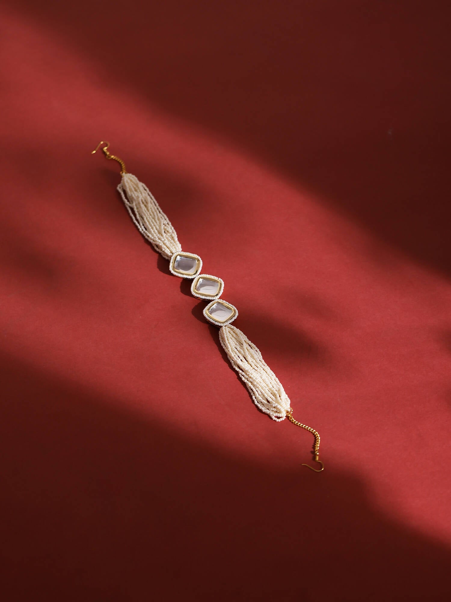 Gold-Polished White Kundan-Studded Pearl Beaded Hair Band - Ruby Raang | Grocsy