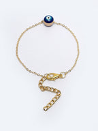 NVR Women Gold-Toned Evil Eye Rakhi With Roli Chawal | Grocsy