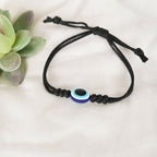 NVR Women & Men Black Evil Eye Rakhi With Roli Chawal | Grocsy