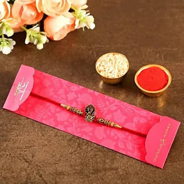 Serene Lord Krishna Rakhi & Cadbury Fruit N Nut | Grocsy