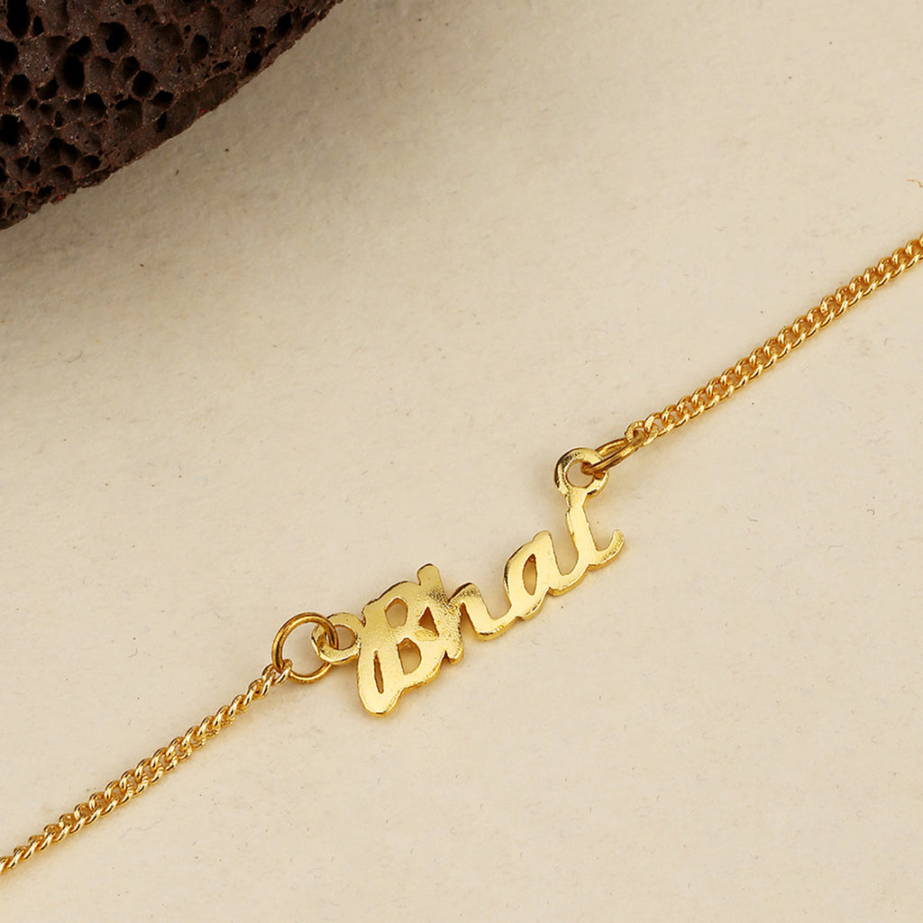 trueBrowns X Voylla Gold-Toned 'Bhai' Bracelet Rakhi With Roli Chaawal Pack | Grocsy