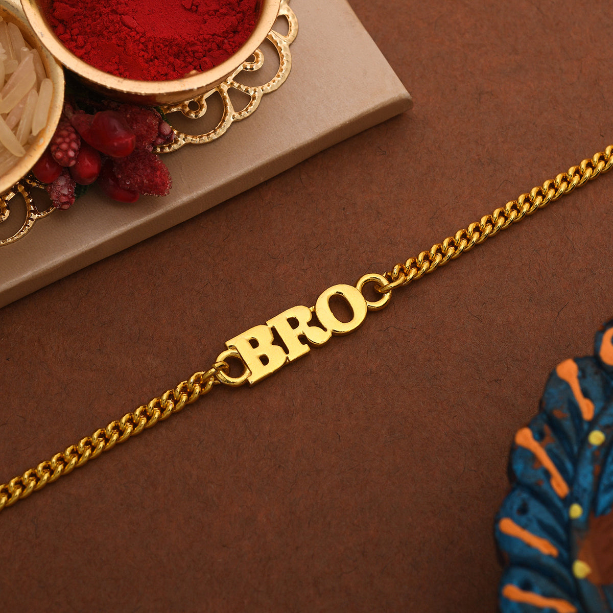 trueBrowns Gold Tone Fashionable BRO Rakhi | Grocsy