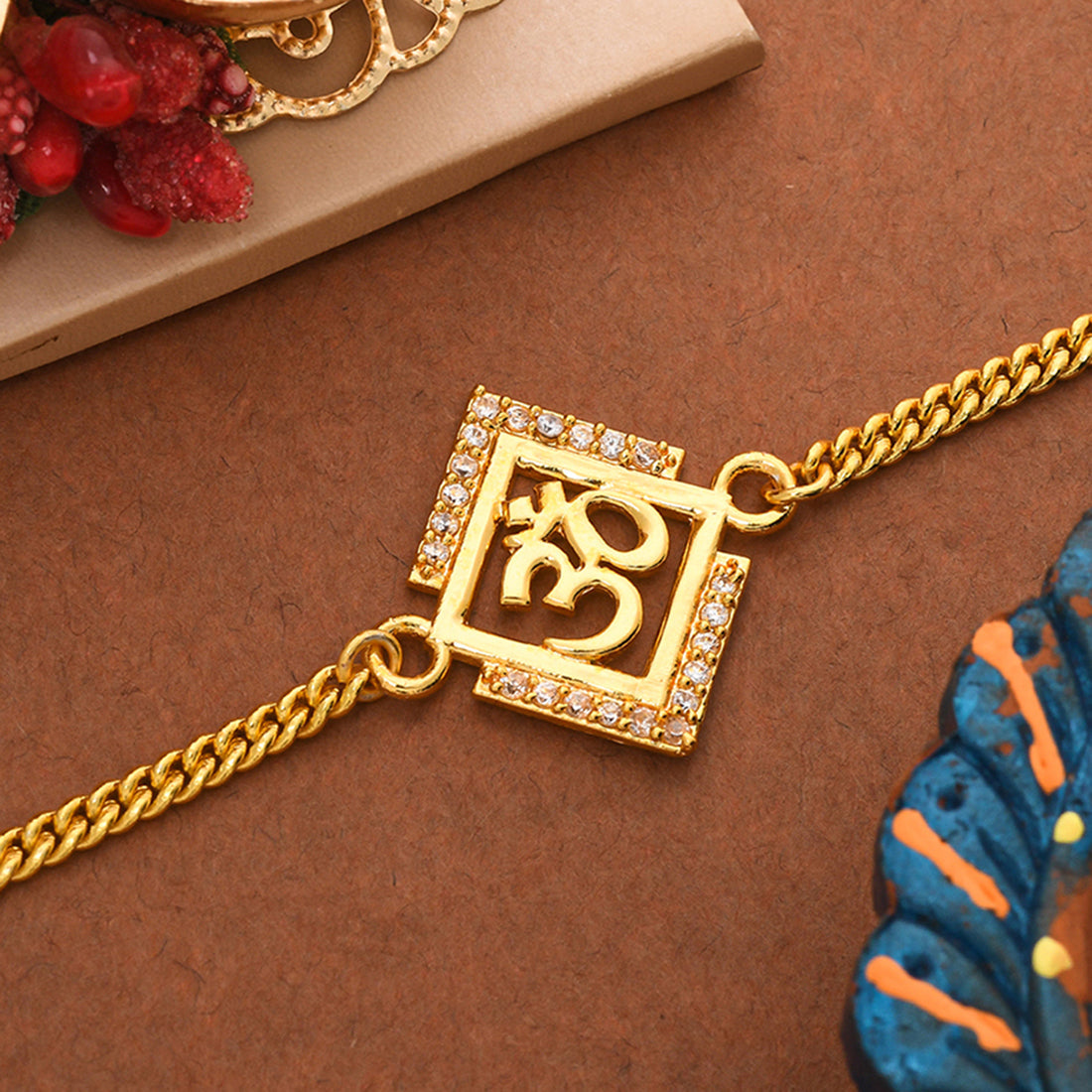 trueBrowns Gold Tone Auspicious OM Bracelet Rakhi | Grocsy