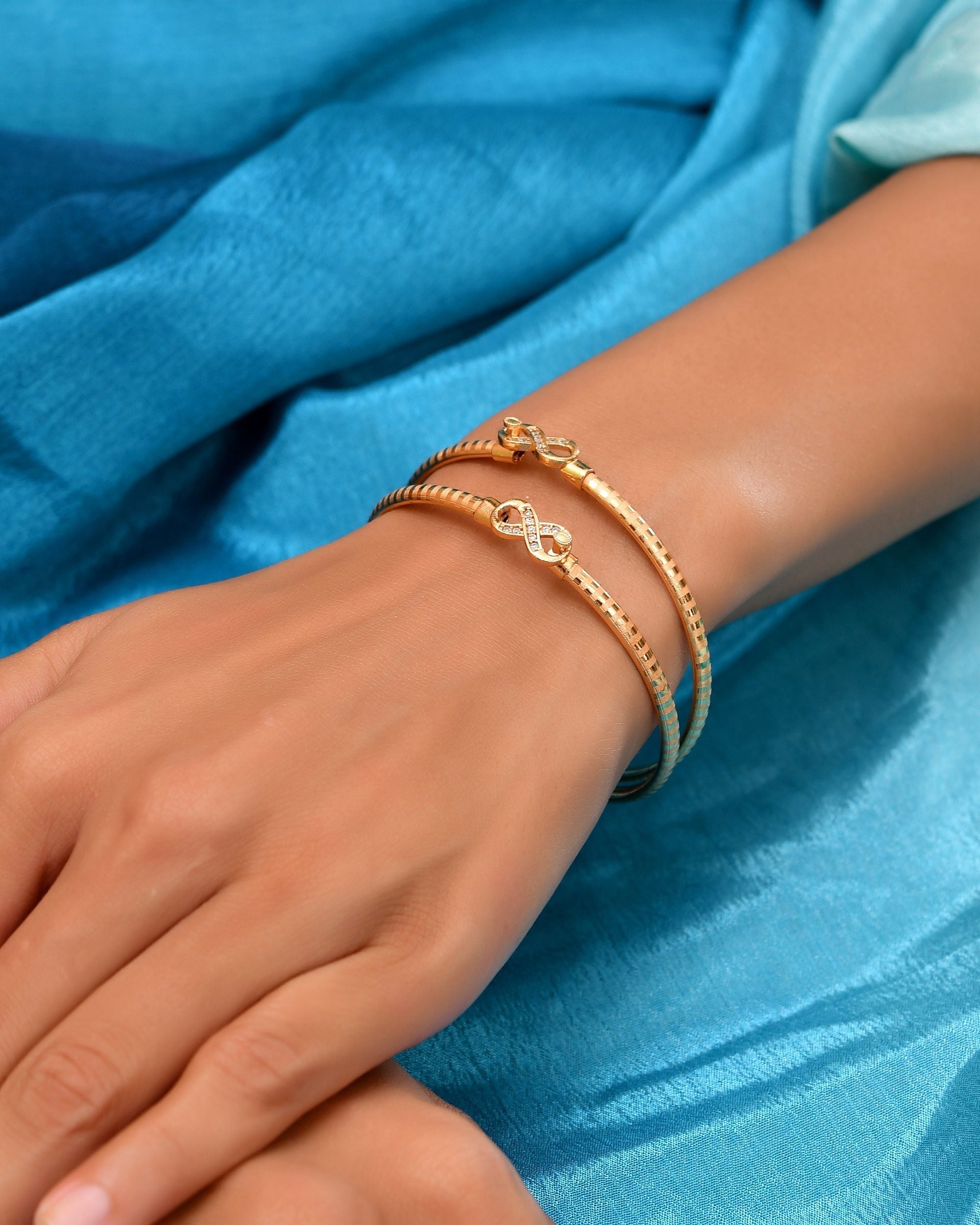 VOJ Set Of 2 Gold Polished AD Studded Infinite Shaped Bangles | Grocsy