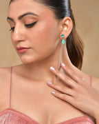 VOJ Silver Plated Sea Green Stone Studded Studs Earrings | Grocsy