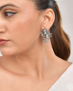 VOJ Silver Plated Oxidized Kanha Shaped Earrings | Grocsy