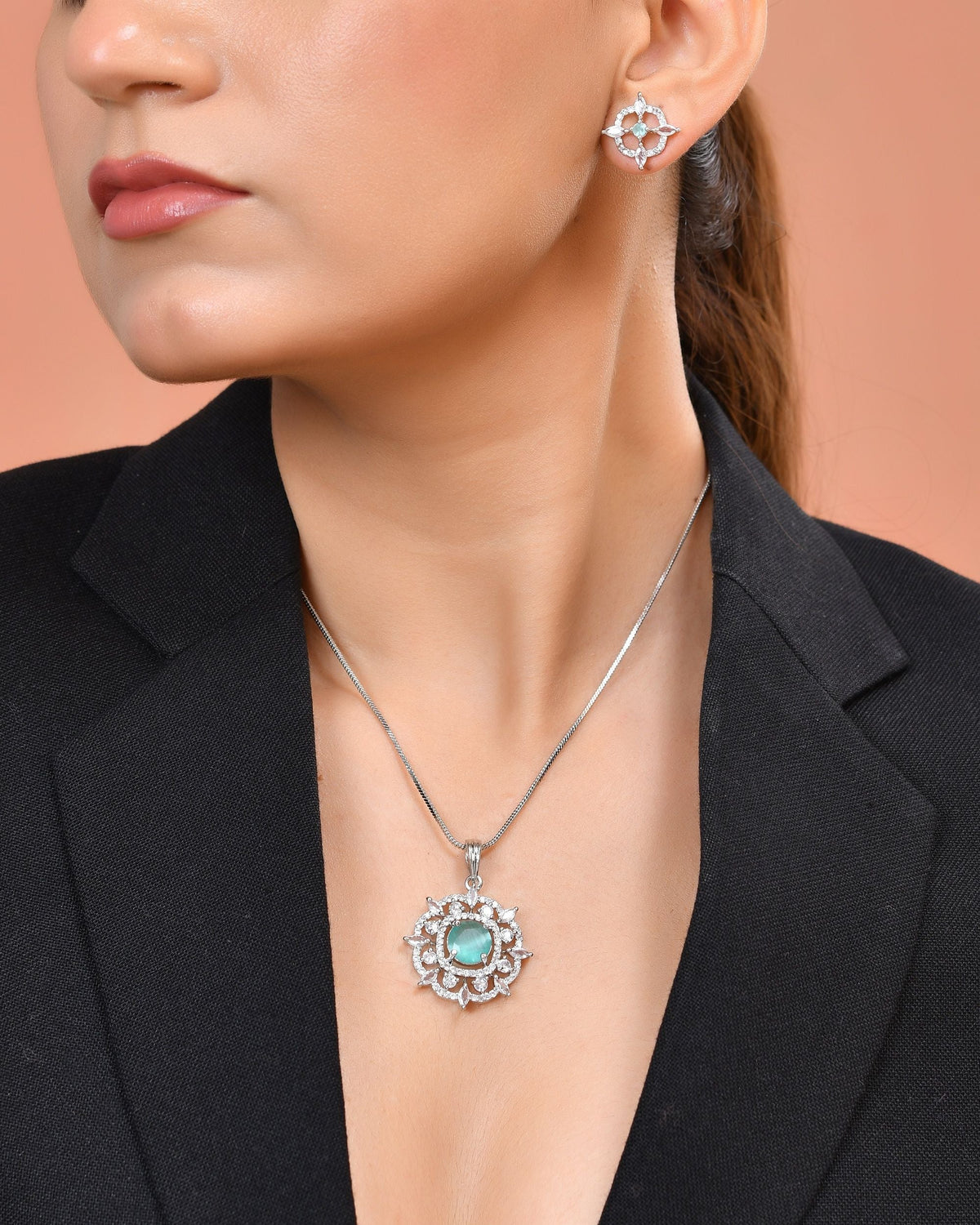VOJ Silver Plated Sea Green Circulare Stone Studded Sun Shaped Ad Pendant With Chain Set | Grocsy
