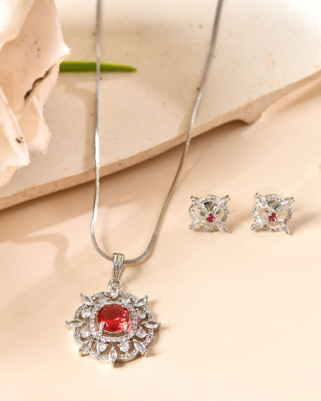 VOJ Silver Plated Ruby Red Circular Stone Studded Sun Shaped Ad Pendant With Chain Set | Grocsy