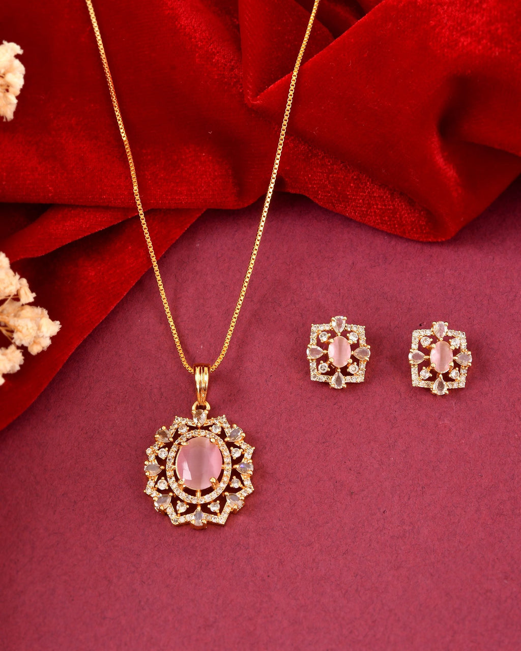 VOJ Gold Toned Baby Pink Oval Stone Studded Sun Shaped Ad Pendant With Chain Set | Grocsy