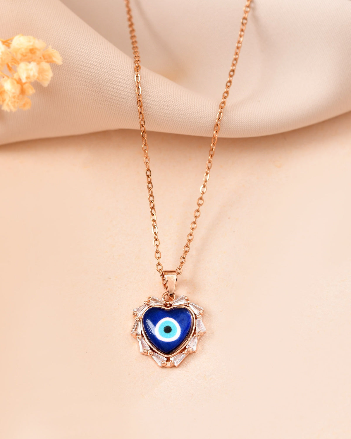VOJ Rose Gold Plated Heart Shaped Evil Eye Pendant With Chain | Grocsy
