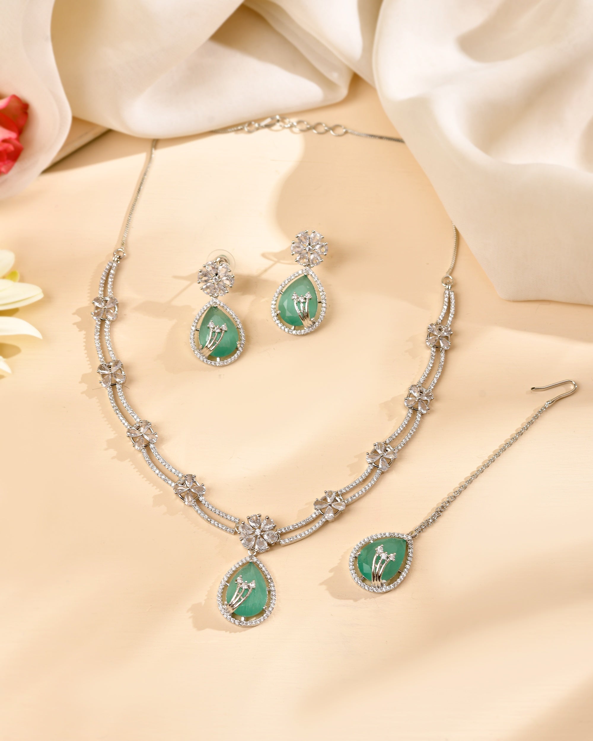 VOJ Silver Plated Teal Green Teardrop Shaped Stone And Ad Stone Jewellery Set With Maang Tikka | Grocsy