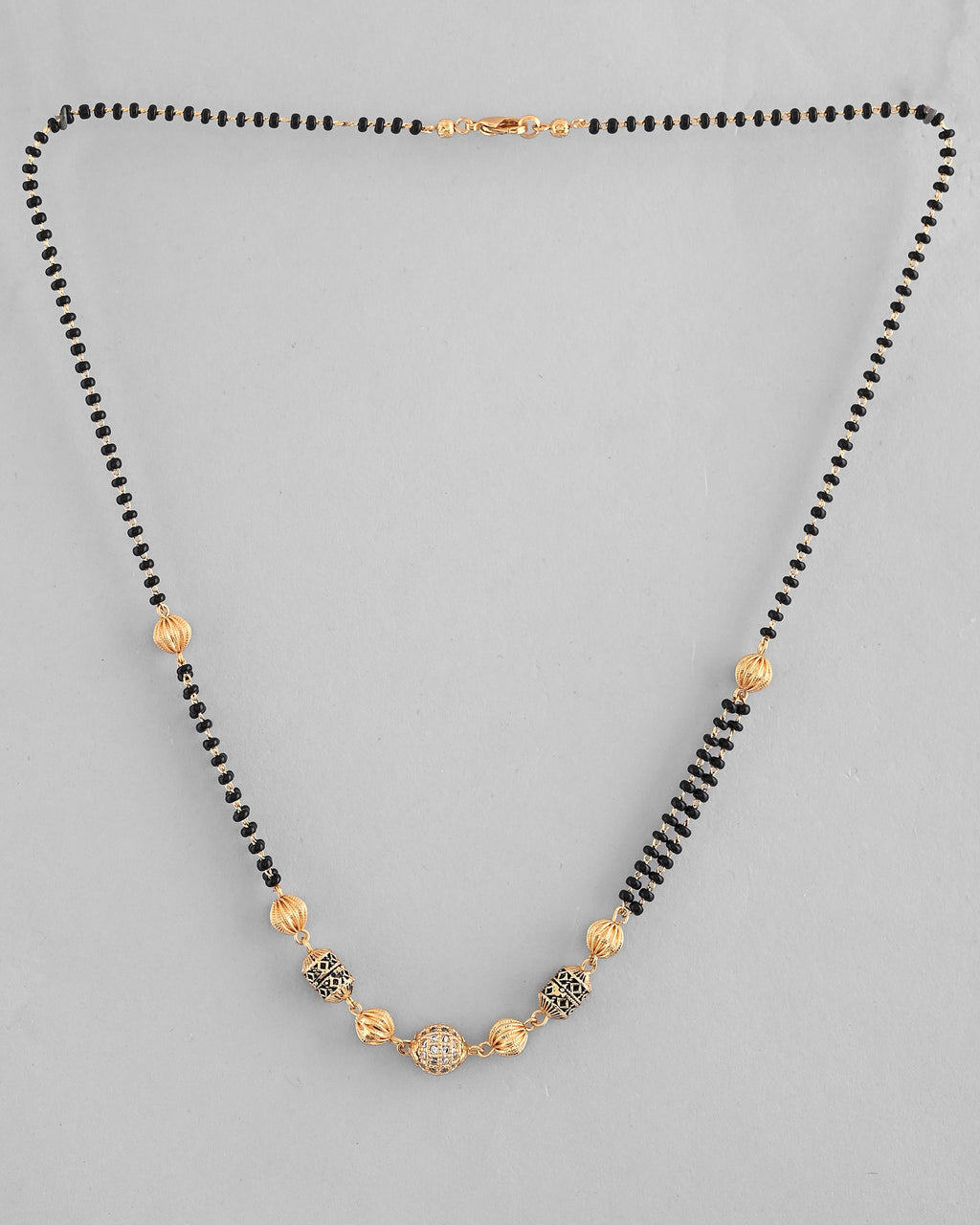 VOJ Gold-Polished Stone Studded Cricular shaped Mangalsutra | Grocsy